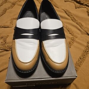 Woman's Black, White, and Tan Loafers. Franco Sarto